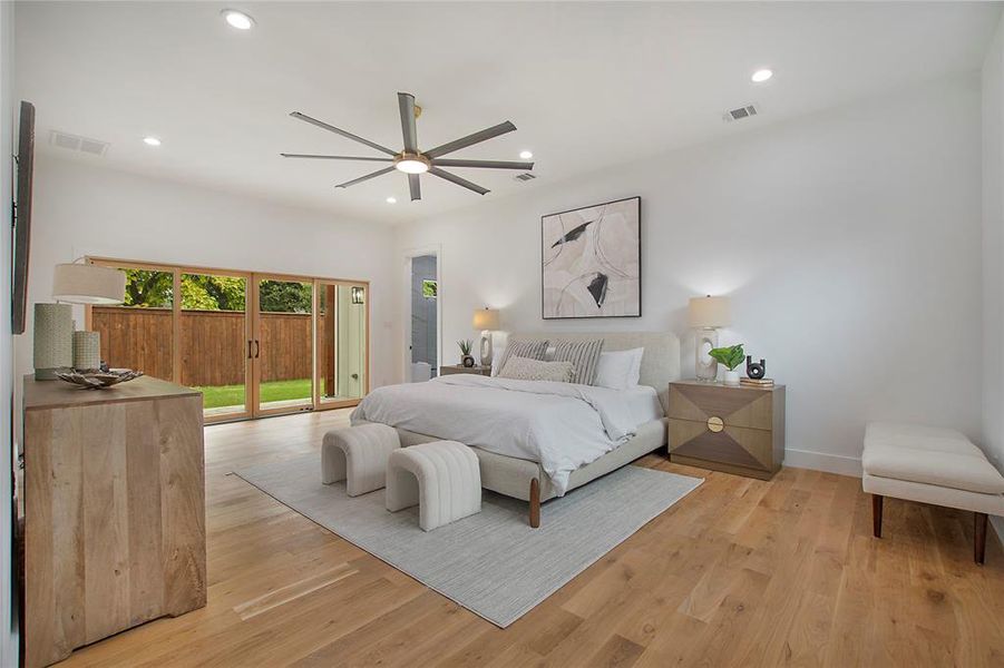 Bedroom featuring light wood-type flooring, ceiling fan, and access to outside