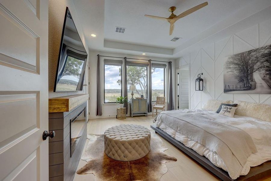 Master Suite with Amazing Views! Motorized Shades, Deco Wall, Ceiling Fan, Electric Fireplace, Door to Patio & Sitting Area!