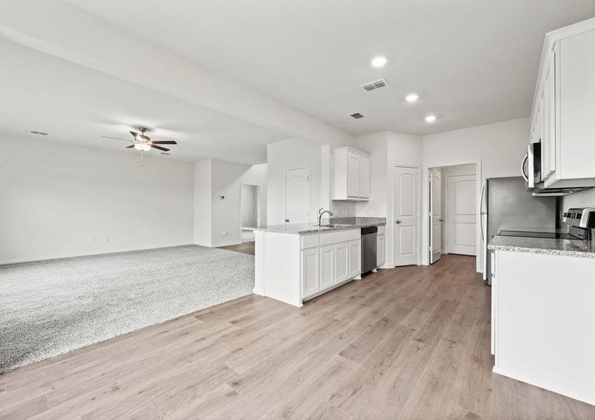 The kitchen of the Cypress sits in between the family room and dining room.