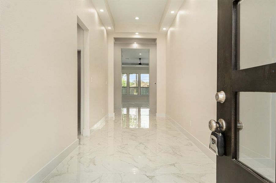 The grand entryway draws you into a voluminous layout made for entertaining