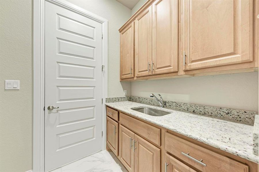 Laundry Room with Sink and Cabinets for Storage