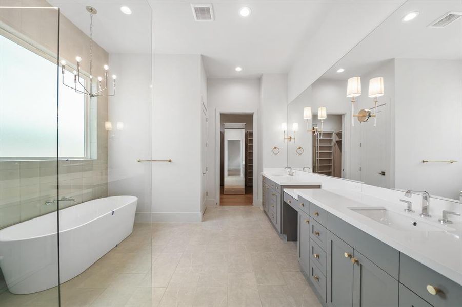 Walk-in shower, soaker tub, double vanity and makeup counter, plus a water closet!