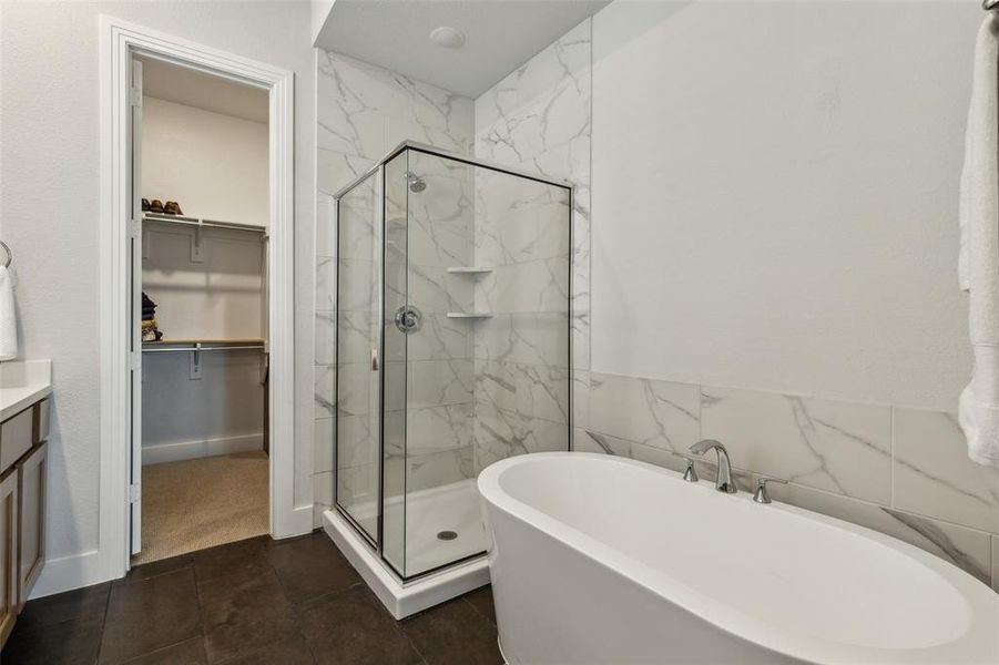 Primary bathroom with separate shower and tub.