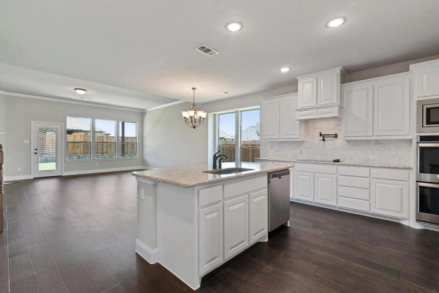 Kitchen to Nook | Concept 3015 at Belle Meadows in Cleburne, TX by Landsea Homes