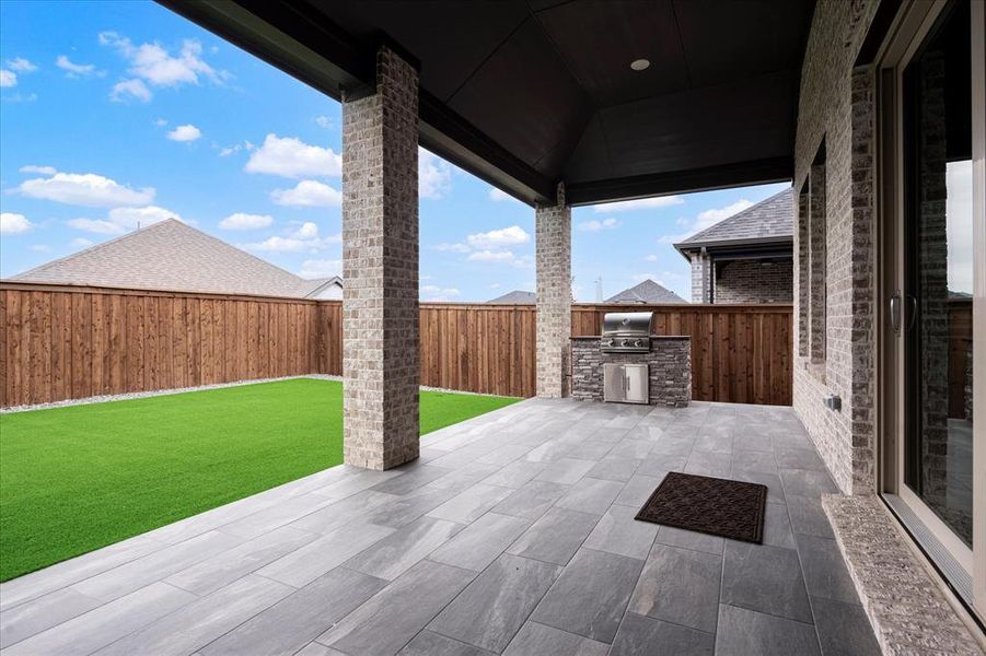 View of patio / terrace with an outdoor kitchen and a grill