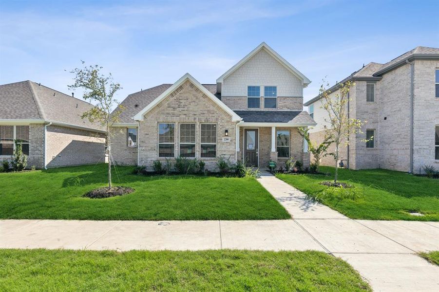 Craftsman-style house featuring a front yard