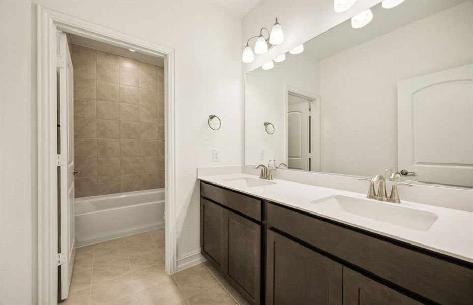 Spacious secondary bathroom with dual vanity *real home pictured