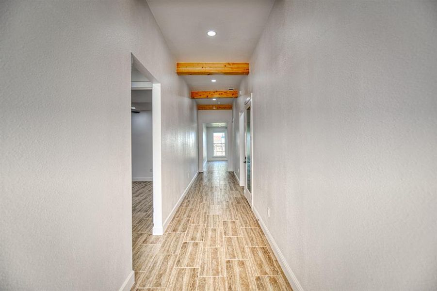 Corridor featuring light hardwood / wood-style floors