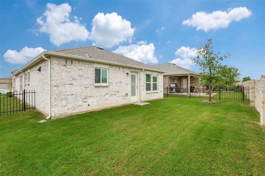 Private backyard backing to stone wall