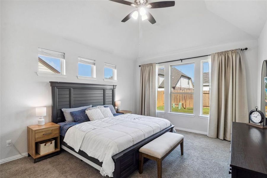 Bright and airy master suite with dual-aspect windows for abundant natural light.