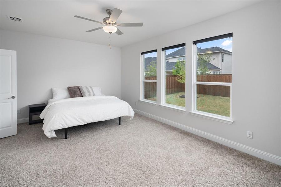 Bedroom with carpet flooring and ceiling fan