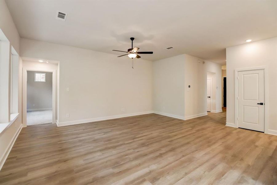 EXAMPLE PHOTO: Big open Living area w/high ceilings and wired for surround sound.  Plus low maintenance vinyl plank floors
