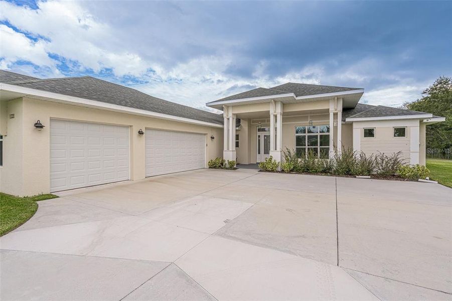 Wide and extended driveway with plenty of parking.