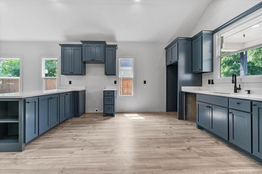 Kitchen featuring sink and light hardwood / wood-style flooring