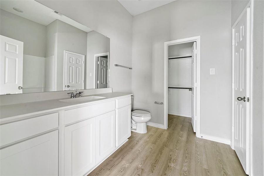 Primary bathroom with walk in closet