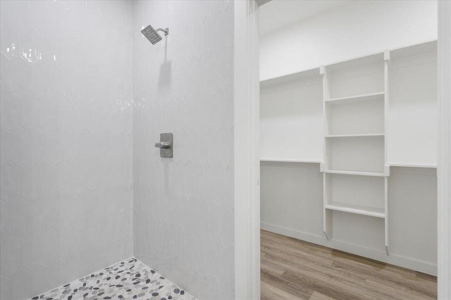 Bathroom featuring a shower and hardwood / wood-style floors