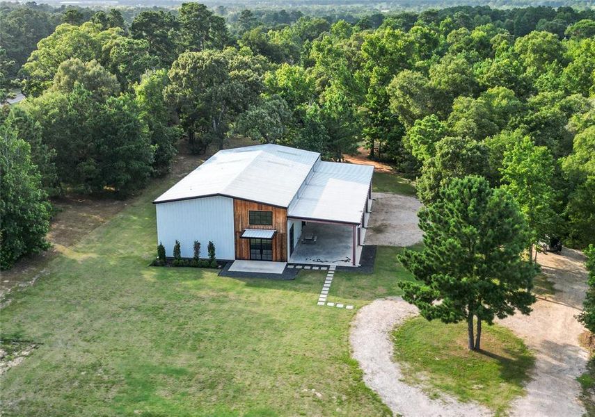 This luxury barndominium offers fine living with commercial potential!