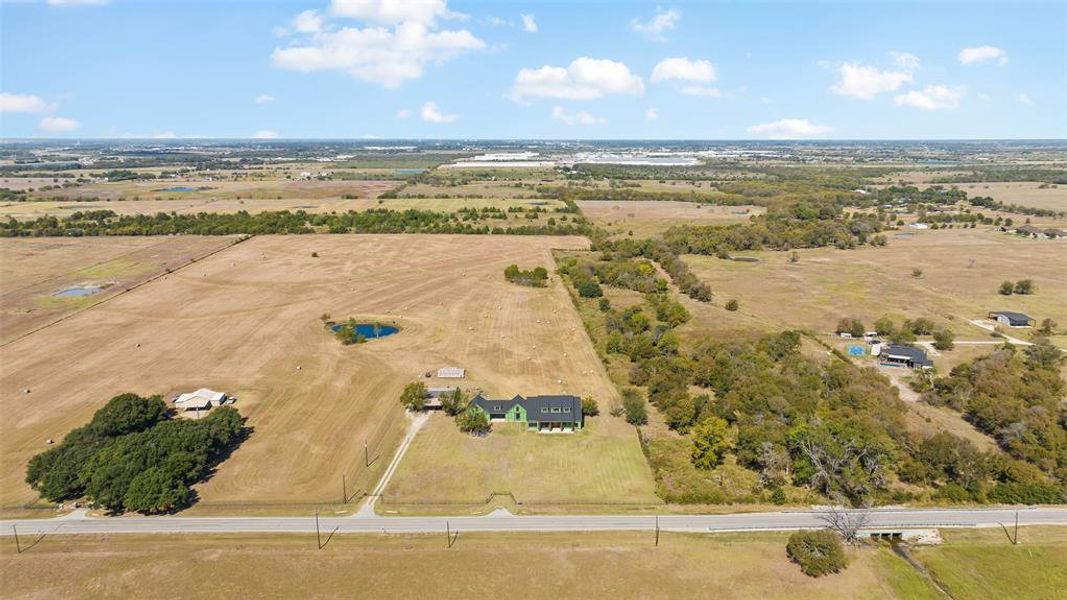 Birds eye view of property featuring a rural view