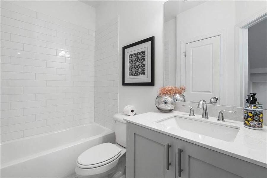 Full bath off the Kitchen is great for your guest when staying over. - Photos shown are of model home for viewing purpose only.