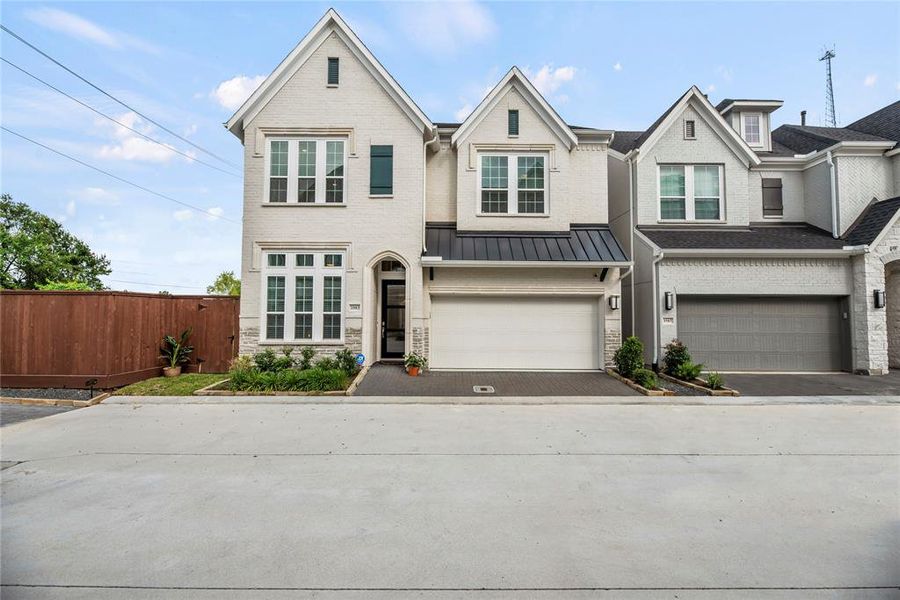 Gorgeous Brick & Stone Elevation, Tons of Natural Light in this 3 Story Home