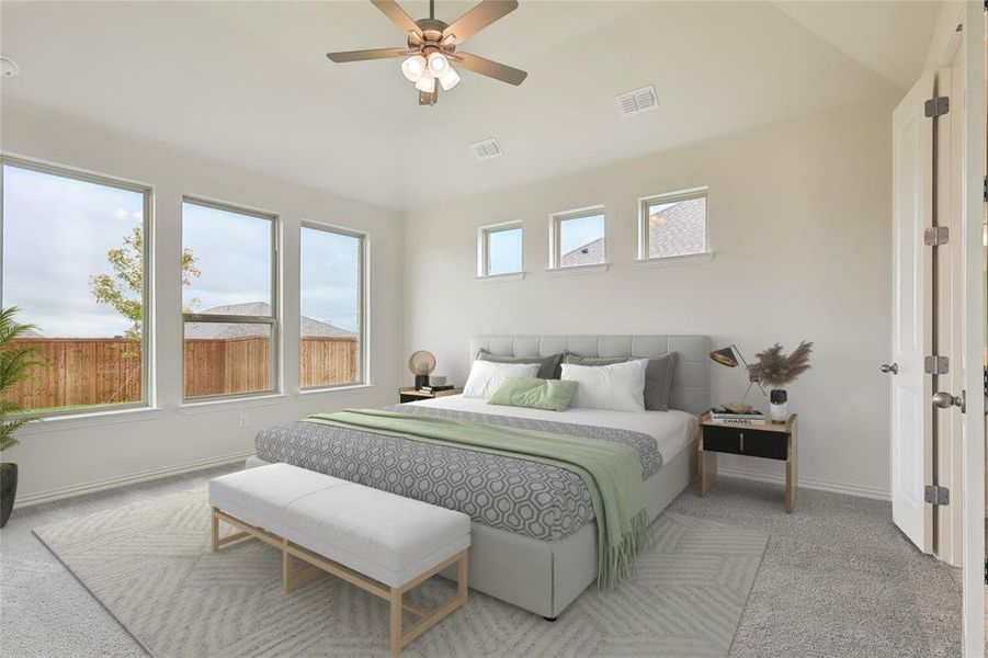 Bedroom featuring light carpet, vaulted ceiling, and ceiling fan