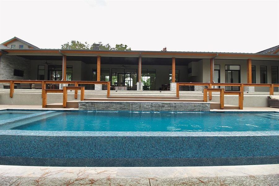 Another view of this resort-like pool and outdoor kitchen!