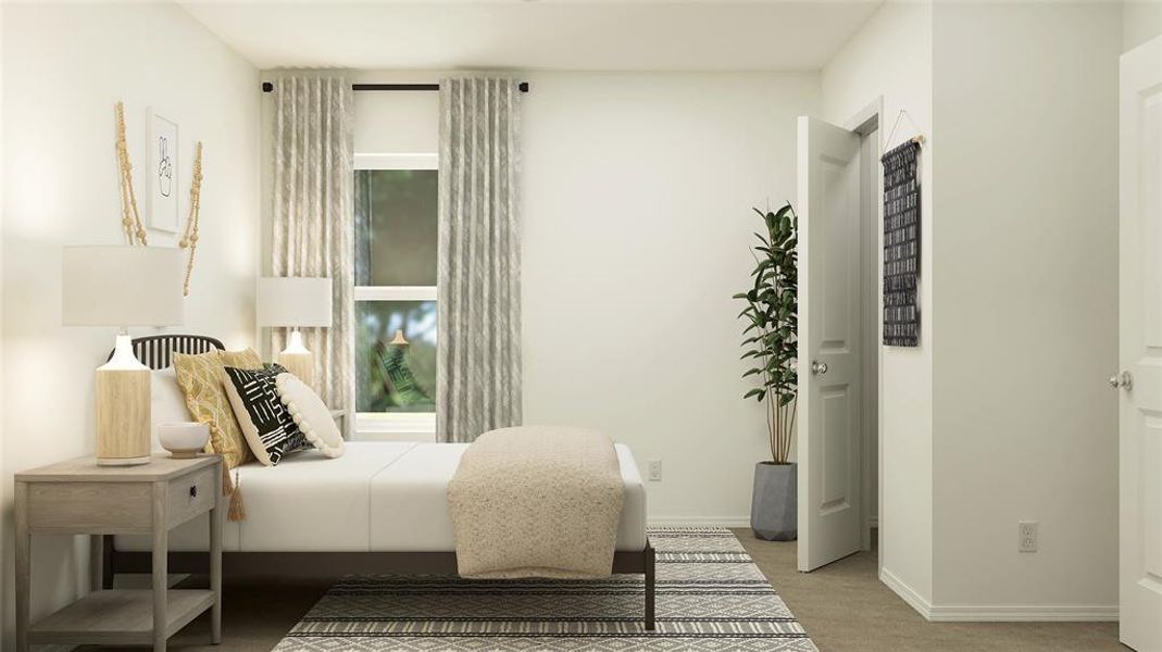 Bedroom featuring light colored carpet