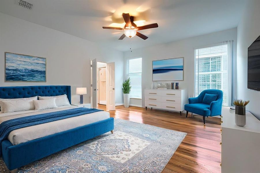 Primary, virtually staged Bedroom with wood-type flooring and ceiling fan