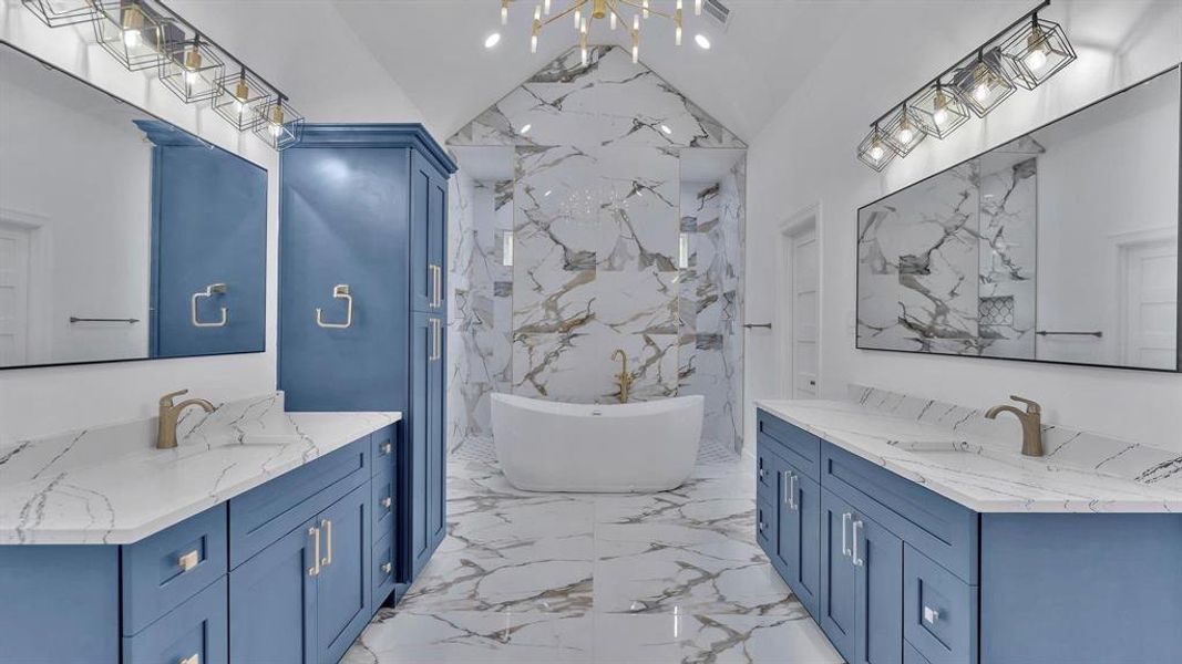 Primary bath is equipped with a jetted soaker tub, his/her sinks, and a large walk in shower. notice all the lighting.  all the cabinets are soft close cabinets.