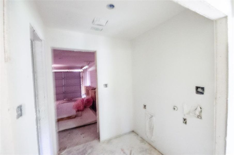 Laundry room with carpet floors