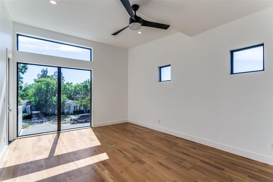 Unfurnished room with hardwood / wood-style floors and ceiling fan