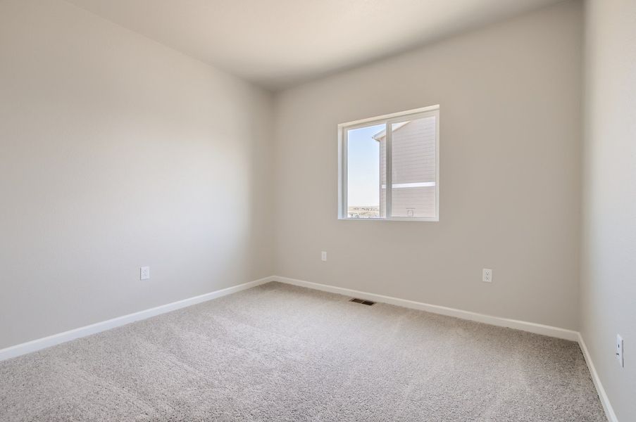 Secondary bedroom of the ranch style Telluride plan by Century Communities