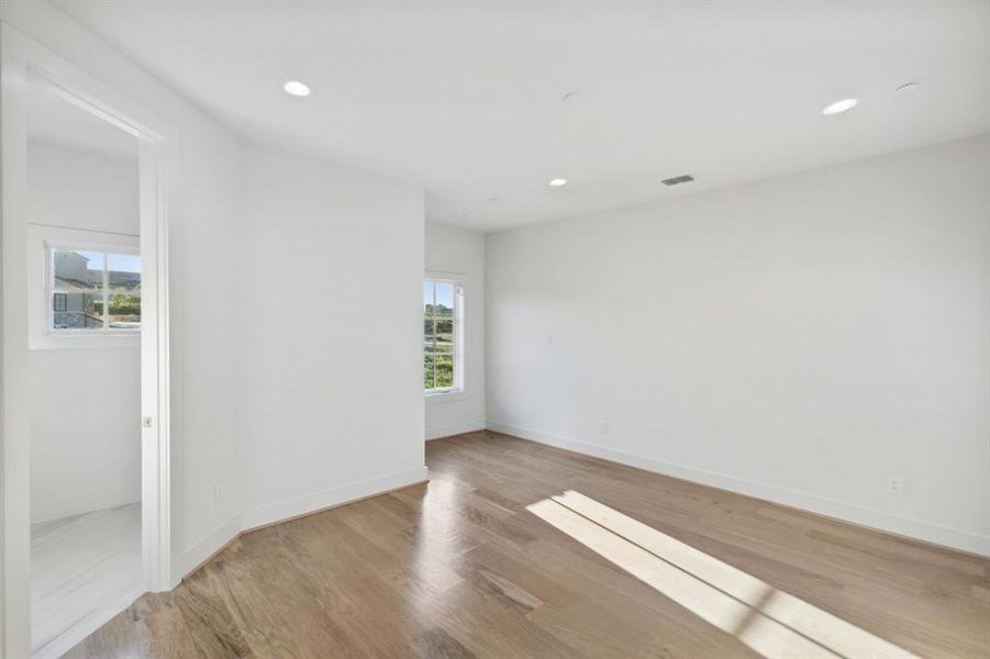 Unfurnished room with plenty of natural light and light hardwood / wood-style flooring