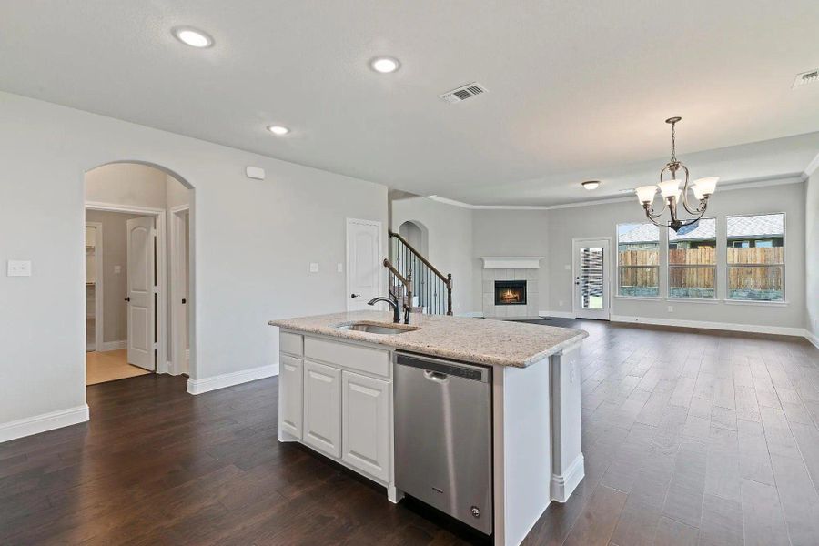 Kitchen to Family Room | Concept 3015 at Belle Meadows in Cleburne, TX by Landsea Homes