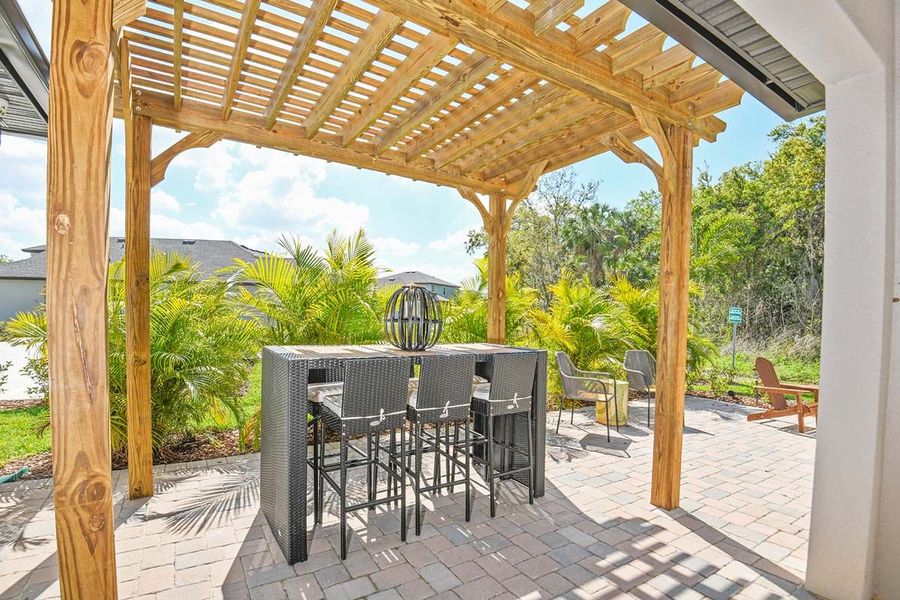 Sandalwood new home plan outdoor dining area at Tea Olive Terrace by William Ryan Homes Tampa