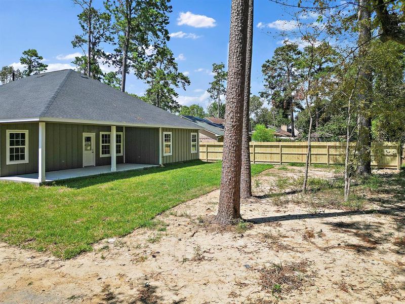 This new construction, surrounded by mature trees, is more than just a home—it's a sanctuary that blends modern luxury with the timeless allure of nature.