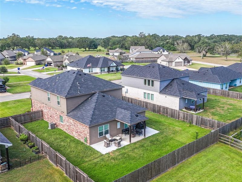 Backyard of this lovely home.  The added back patio extends the entire width of the back of the home.