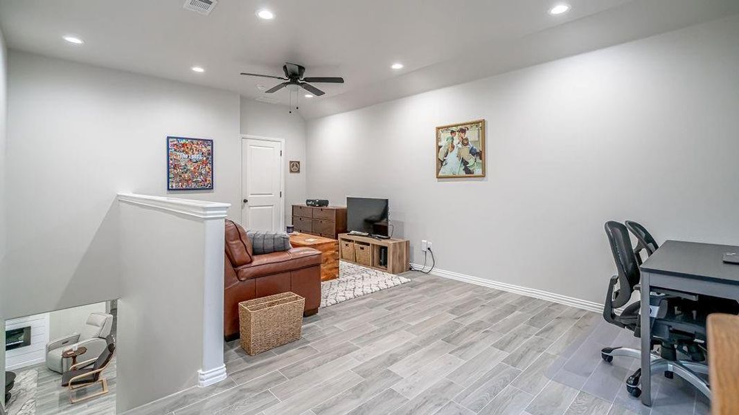 Upstairs Office/Loft featuring ceiling fan and light hardwood / wood-style flooring