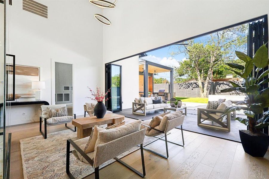 Lounge area view from wine vault and feature wall looking out into backyard oasis.