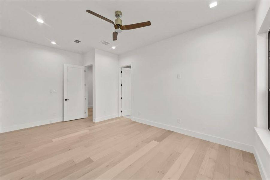 Master Bedroom with light hardwood / wood-style floors and ceiling fan