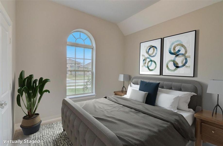 Bedroom 2 offers a cozy retreat with a charming view through the outside window.