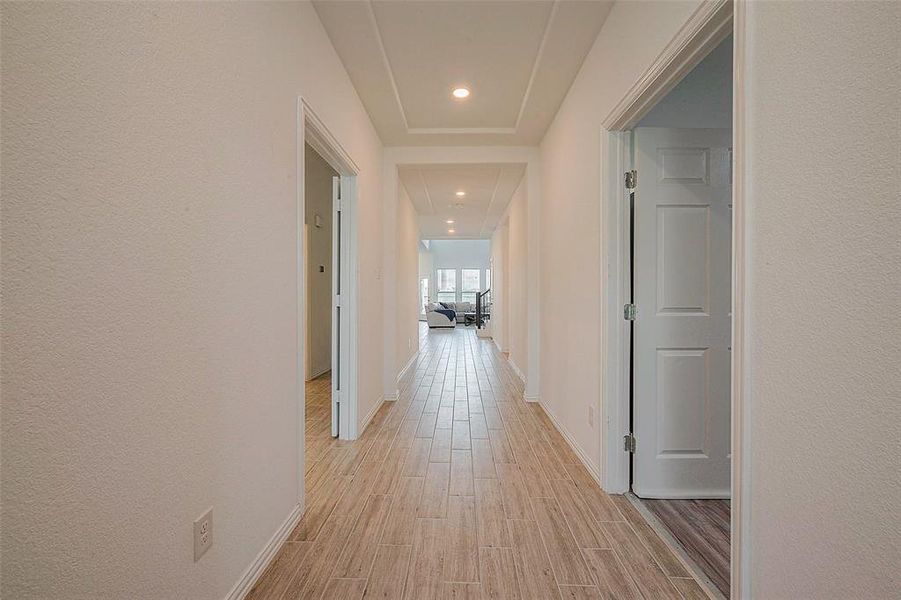 This clean and tidy hallway suggests a home that is well-cared for.