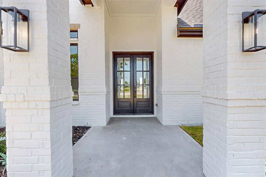 Entrance to property featuring french doors