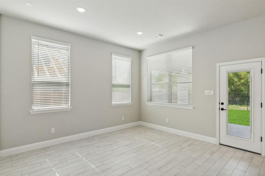 Spare room featuring light wood-type flooring