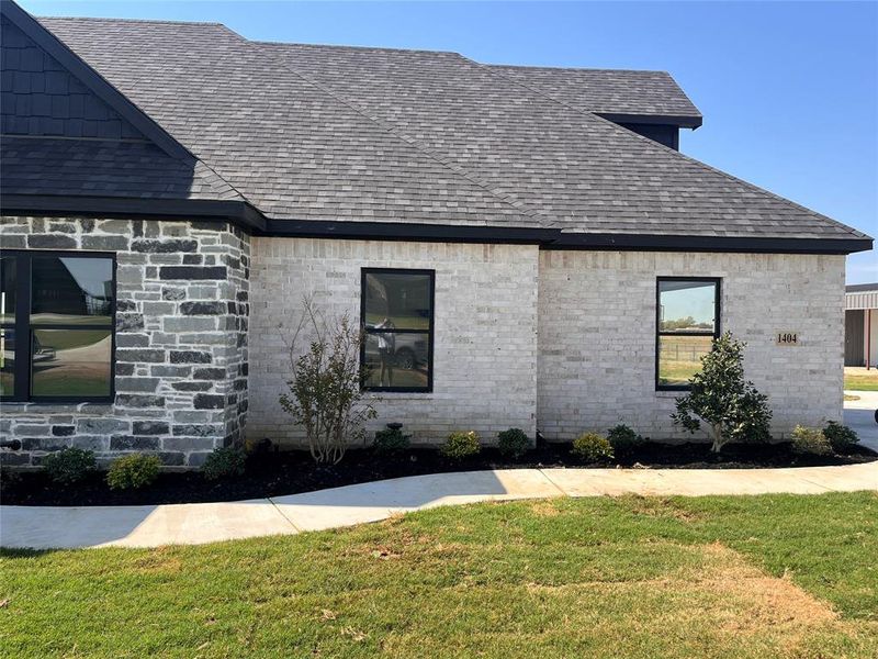 View of front of home featuring a front lawn