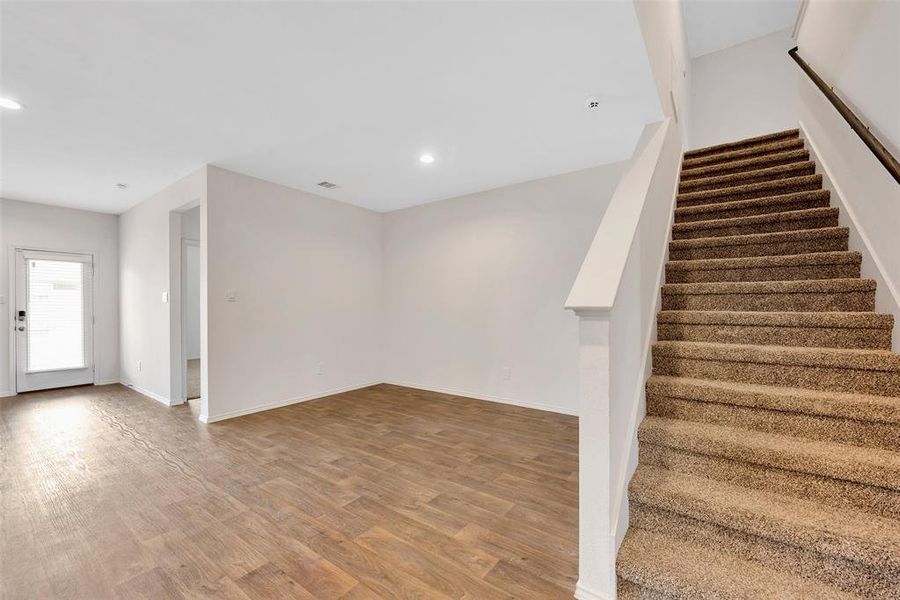 Another view of the dining room. The door on the left leads to the backyard and the stairs lead you all the second floor has to offer.