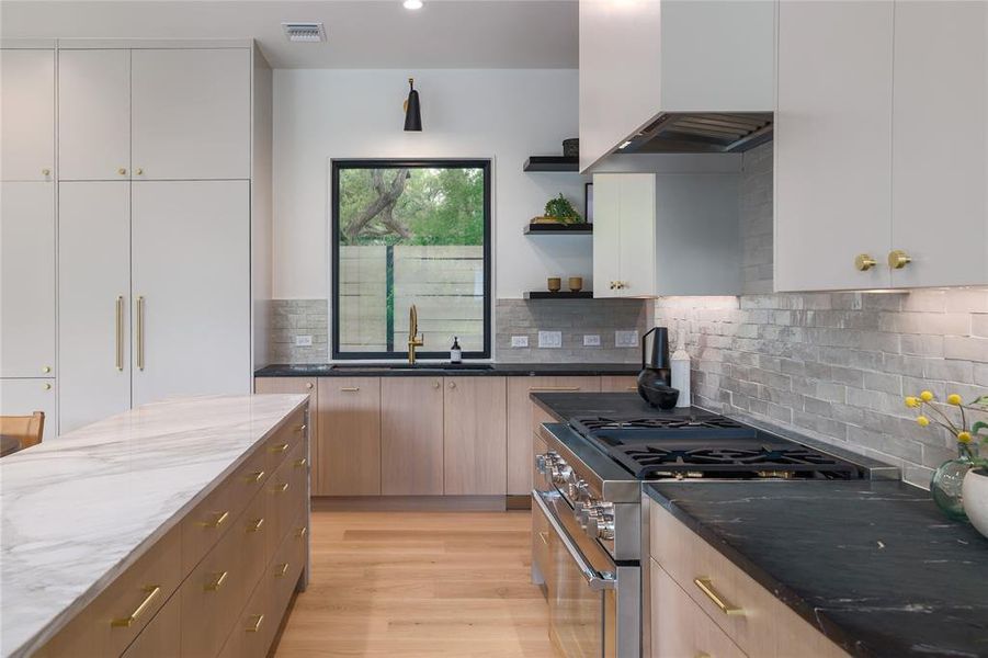 The dual fuel Thermador range, Thermador fridge and freezer columns and massive workstation sink all sit within a few feet of one another for maximum utility and minimal steps. This kitchen is designed to be both beautiful and a workhorse....
