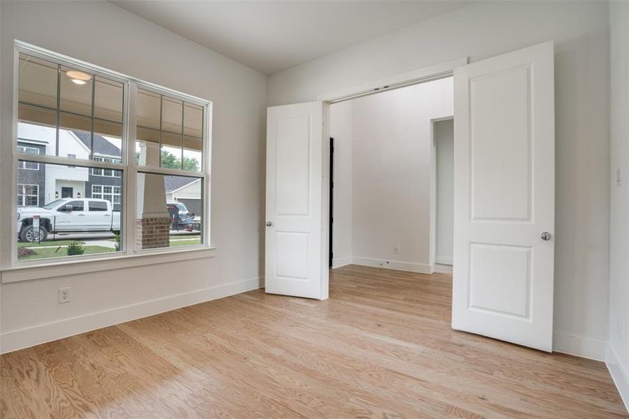 Unfurnished bedroom with light hardwood / wood-style floors