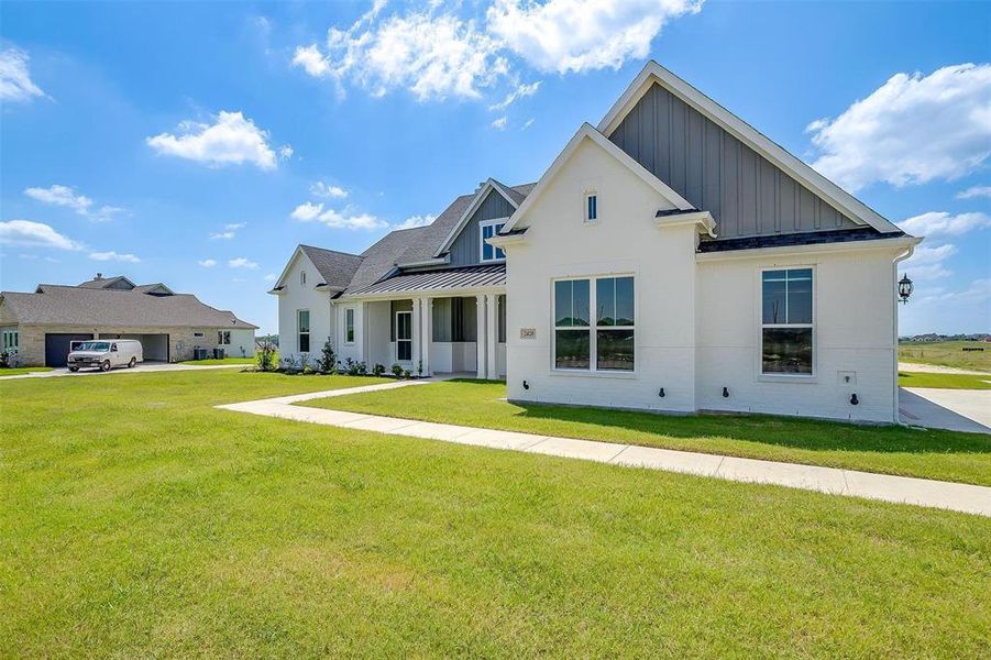 View of front of home featuring a front lawn