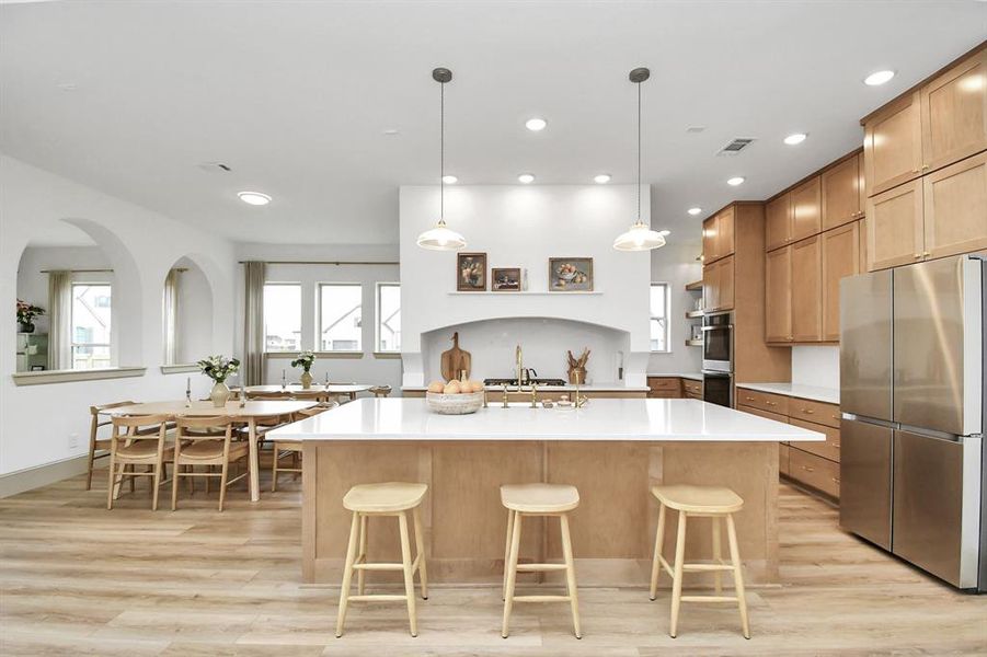 The kitchen is a chef's dream with gas cook top, double oven, ample counter space and cabinet/drawer storage AND a butler's pantry.